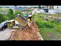 delete pond processing filling up the land huge bulldozer komatsu dr51px dump truck unloading