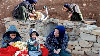 A pregnant nomadic mother builds a stone shelter for her children against the cold and rain.