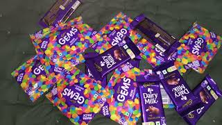 Some lot's of Cadbury dairy milk chocolate and Cadbury gems