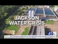 Water main break floods Jackson apartment complex parking lot