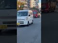 城北公園通り（北区本庄西）を走るパトカー（大阪府警察）