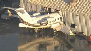 Plane crashes into hangar at US airport