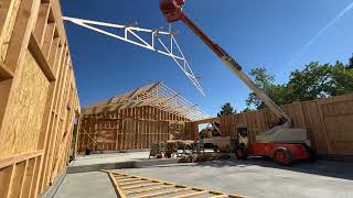 Setting 40’ span Trusses with a Lift! Hang On #framing #carpentry #shopbuild