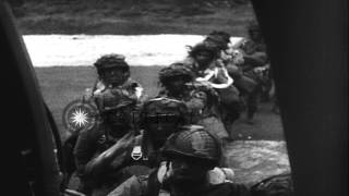 US Army paratroopers board C-47 aircraft and take off to invade France on D-Day o...HD Stock Footage