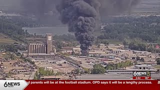 Industrial fire creates plume of thick, black smoke over Carter Lake area