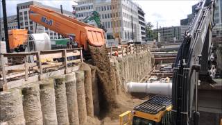 Excavator Volvo EC250 and truck