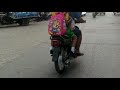 hi watch the video of motorbikes parked on the road in the village town city city many houses