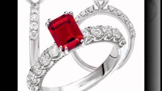 KI-117317-100 18k diamond engagement ring with 7x5mm emerald cut center, shown still with a ruby