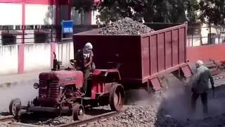 Iron wheel tractor on railway track