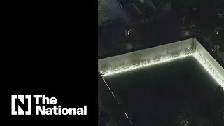 9/11 memorial lit up as dawn breaks in New York