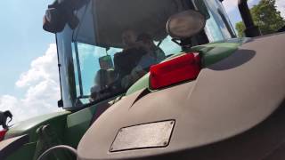 hauling the wheat to the grain bins with the farmers children with John Deere 8320