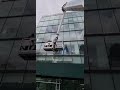 lifting new large window glass panels with boom lift using free powerlift system by alpha platforms