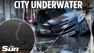 Flooded Dubai paralysed by year of rain in 24hrs as city denies cloud-seeding to control weather