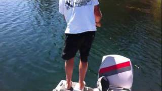 Man GETS PULLED OVERBOARD by bass and LANDS THE FISH!