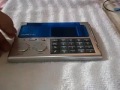 ultronic travel alarm clock and am fm radio and calculator