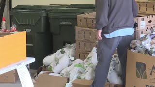 Madison police officers distribute Thanksgiving food to families