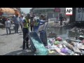 aftermath of car bombs that killed 12 people and wounded 30 others on monday