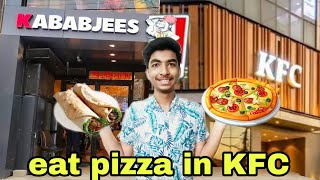 Eating pizza in KFC