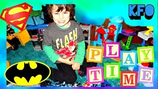 Kid Playing with Imaginext DC Super Friends Batman caves and Superman playset - KIDS FROM OZ