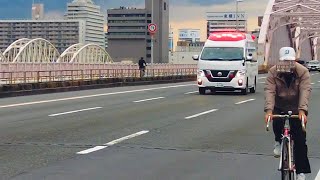 十三大橋を梅田方面に向かう救急車（A270） | 大阪市消防局