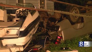 Rollover crash brings down utility pole and damages boat in Riga