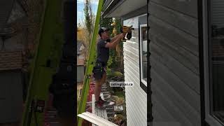 Nailing vinyl siding the easy way - cordless Dewalt roofing nailer with adapter tip