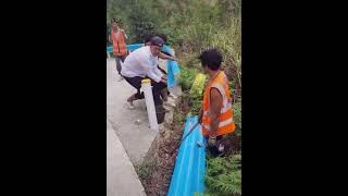 Amazing workers installing safety fence on cliff road