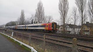 Multi colour SWR Class 158, 159's and 444's passing at West Byfleet on 04/03/22