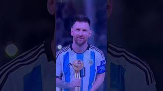 Lionel Messi kisses the FIFA World Cup Trophy