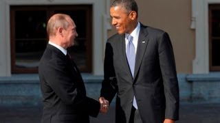 Obama and Putin greet with long handshake