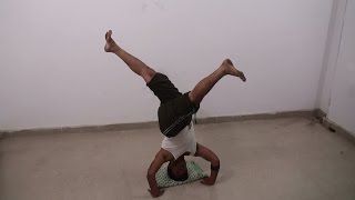 Single Leg Revolved Head Stand - Parivrttaikapada Shirshasana