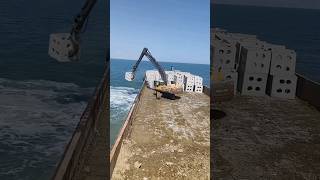 Why JCB throwing blocks into the ocean