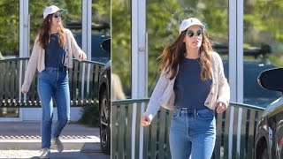 Leighton Meester cuts a casual figure in a cardigan sweater and jeans.