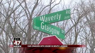 Car crashes into house in South Lansing