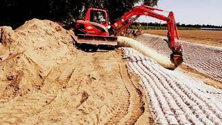 Flexamat® Permanent Erosion Control Mat Roll Being Installed in a Drainage Ditch in Somis CA