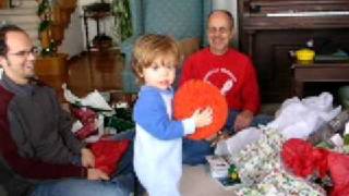 Malcolm plays with big orange koosh