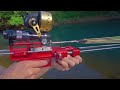 fishing with mechanical slingshot rifle and darts.