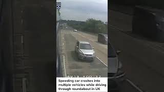 Speeding car crashes into multiple vehicles while driving through roundabout in UK