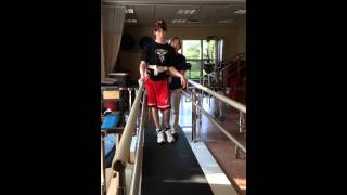 Nate walking in parallel bars