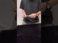 magician makes a pen appear in plain sight