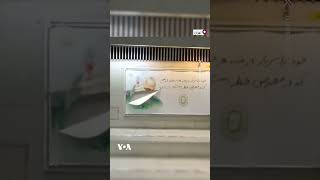 ویدئویی از پاره کردن بنر قاسم سلیمانی توسط یک شهروند با پوشش چادر