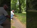 guy using a waving hand to attract a squirrel s attention