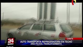Cañete: captan a chofer trasladando enorme refrigeradora en techo de auto