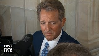 Sen. Jeff Flake answers questions after announcing he won't run for re-election