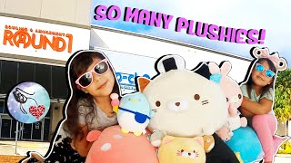 Winning lots of Plushies at Round 1 ! Family fun!