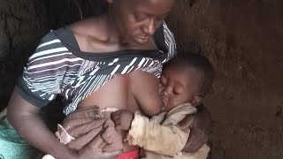 The primitive traditional life of a village housewife and son.True village lifestyle in Africa