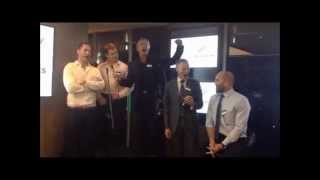 All Blacks, Geoff Sewell, and Sir Lockwood Smith sing the National Anthem