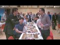 magnus carlsen gives analysis to eric hansen and grandmaster amin bassem in european team cup