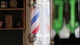 barber pole spinning at a barbershop