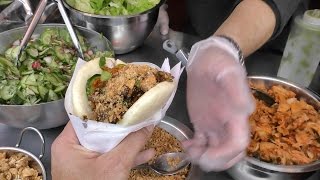 London Street Food. Tasty Chinese-Style Pork Bun Eaten in Camden Town